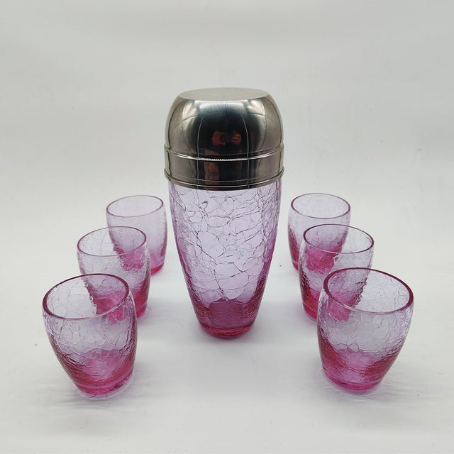 Set with Conctail Shaker and 6 Glasses in Pink Cracle Glass. It is made of Alexandrite and has the particularity of...