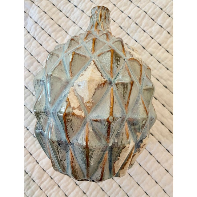 Sculptural studio pottery vase featuring an architectural faceted form with dimensional diamond patterning and an...