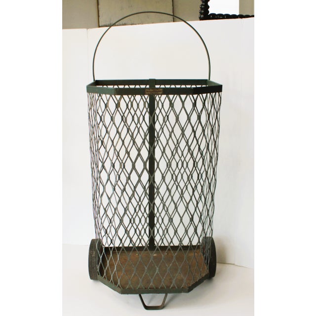 Utilitarian vintage rolling metal/mesh basket market cart. Once used in a French textile mill, we love to repurpose these...