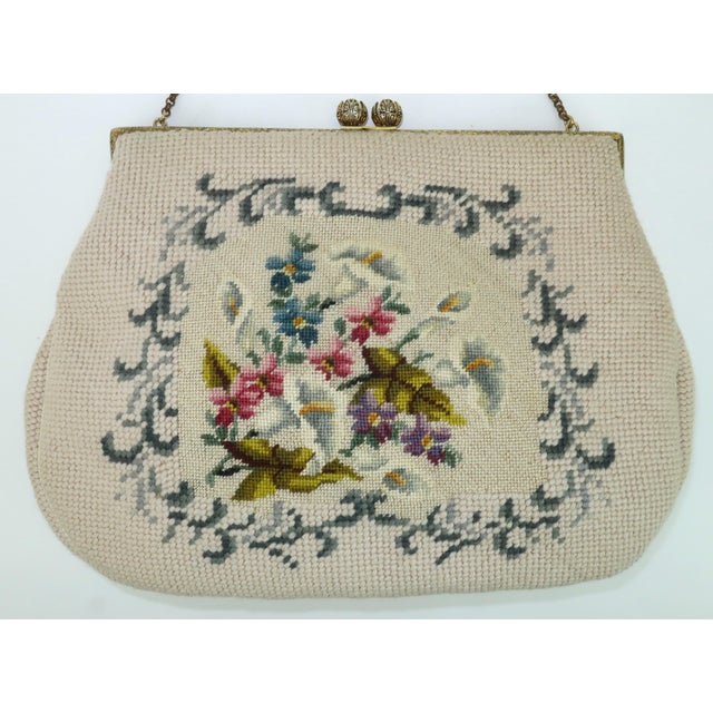 Not all 'granny bags' are created equal! This 1950's needlepoint example is at the front of the pack with a neutral...