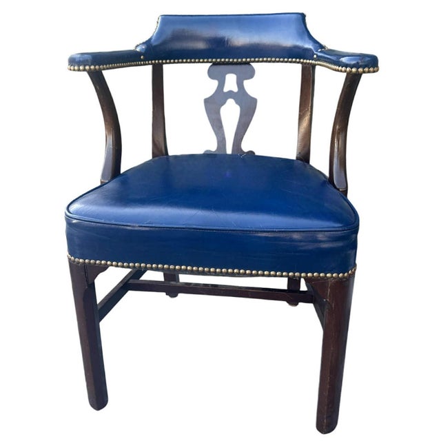 A rare find: A set of circa 1940s walnut club chairs with the original blue leather upholstery in fine condition. Made by...