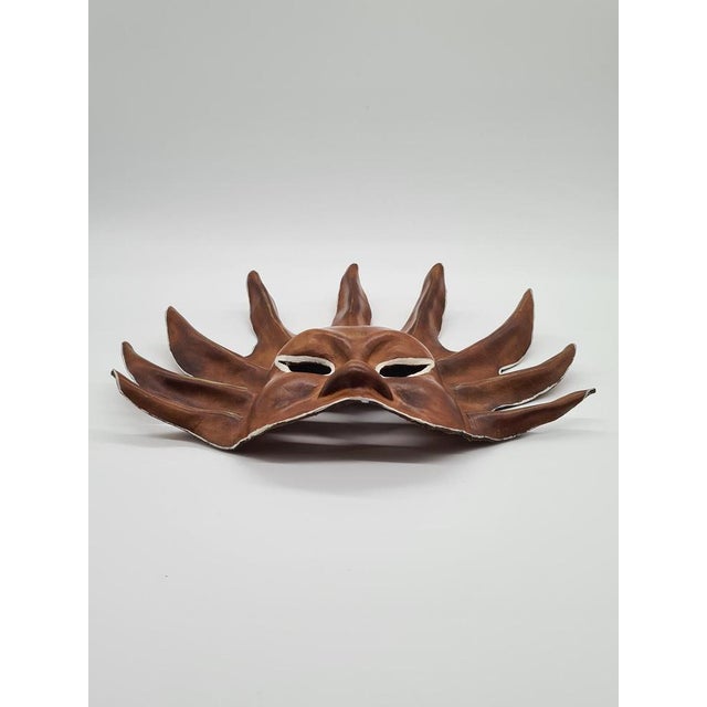 This handmade sun mask made of natural leather is an example of wall decor with a distinctive, eclectic character. Its...