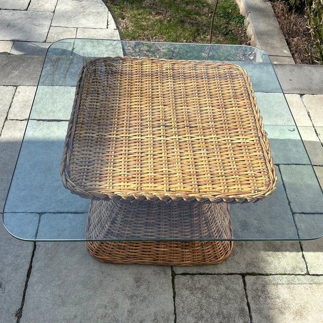 McGuire style braided wicker coffee table. Half inch thick glass top