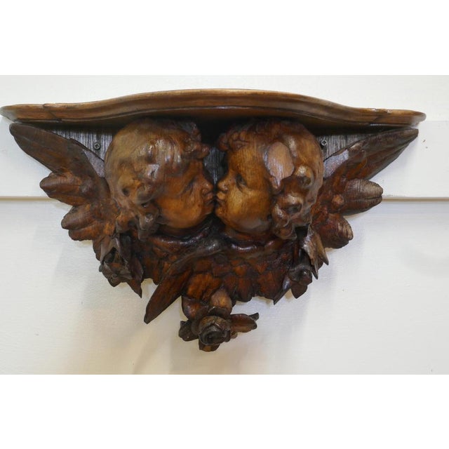 19th Century Carved Wood Cherub Wall Bracket This is a beautifully carved piece, depicting 2 kissing Putti or Cherubs,...