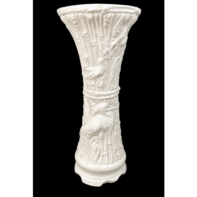 Offered is a vintage white plaster plant stand or pedestal with a tropical motif of bamboo, birds, plants, etc. motif....