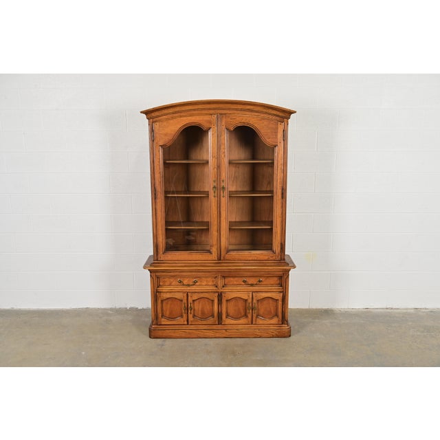 A gorgeous Louis Philippe or French Regency Louis XVI style breakfront bookcase or dining cabinet By Thomasville USA,...