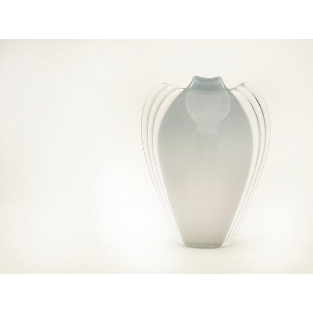 Created in the Vitrix Hot Glass Studio in 1983 by Thomas Scharman Buechner (1926-2010), this stunning blown glass vase...