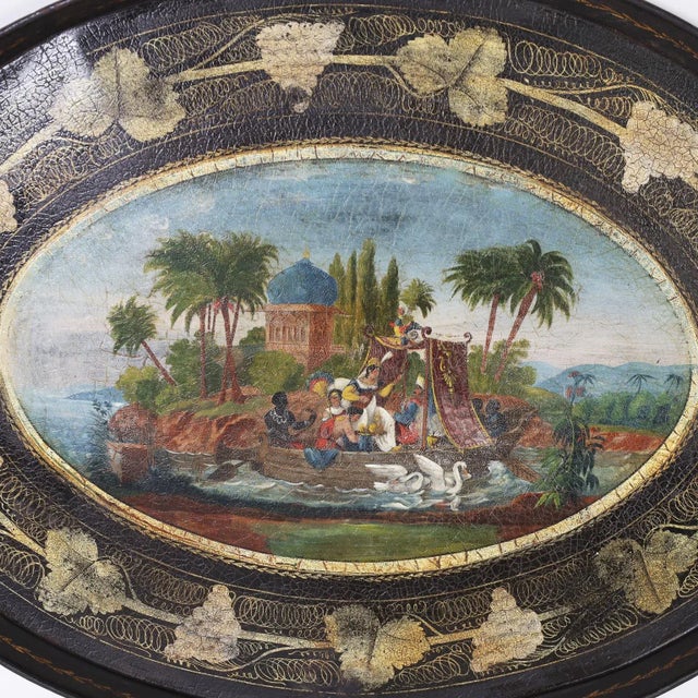 Lofty 19th century English oval tole tray with two cut out handles featuring a colorful orientalist oil painting complete...