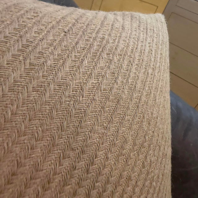 The cover is woven from 100% linen in a herringbone pattern, the angled interlocking weave giving the surface a visible...