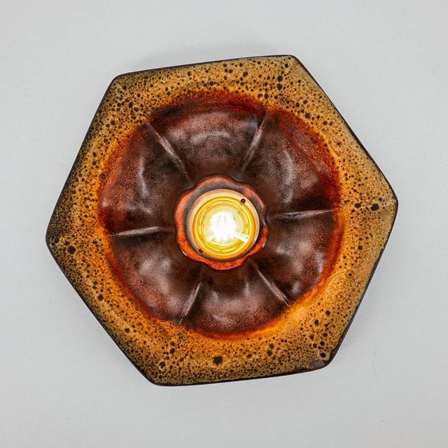 Ceramic wall lights in fat lava style. Manufactured by pan leuchten, germany in the 1960s. The style of the glaze is...