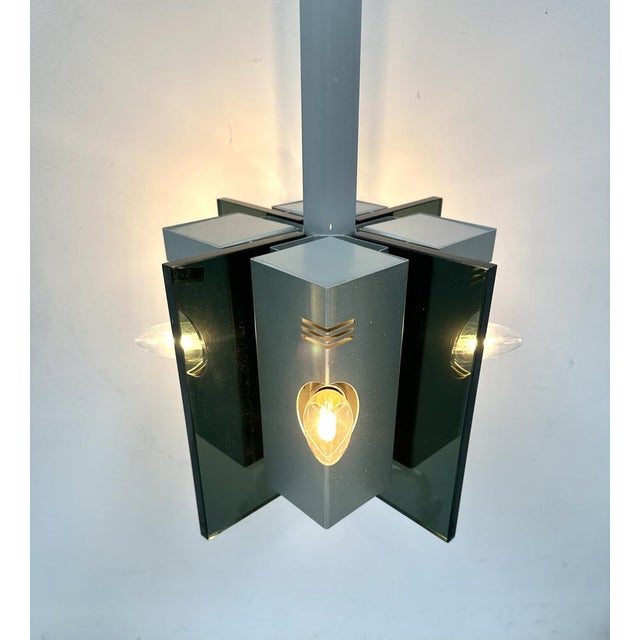 Vintage Italian Pendant Lamp in Aluminium and Smoked Glass, 1970s, in Very Good conditions. Designed 1970 to 1979 Up to...
