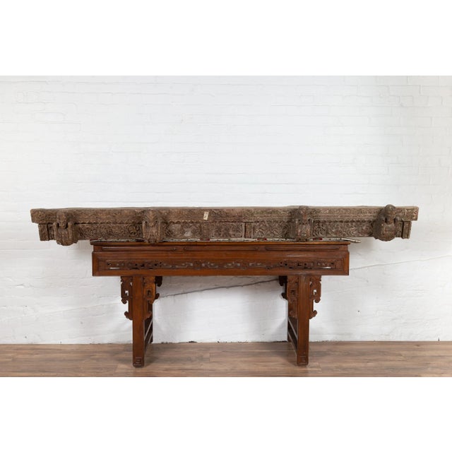 An antique 19th century architectural molding from an Indian temple with carved animals and foliage. Born in India during...