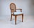 A lovely Louis XVI style open armchair with caned back, exquisite carved detailing, tapered legs and new seat in sky blue...