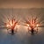 En exceptionally rare and sculptural pair of wall sconces from the Mid-Century Modern period, in the striking Hollywood...