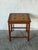 This charming square side table features a distinctive inset tile top bordered by solid wood framing. Tapered cylindrical...