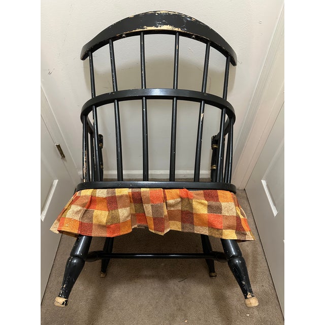 A charming mid-century Windsor-style comb-back armchair manufactured by the Rousseau Bros. Mfg. Co. Inc. of Gardner,...
