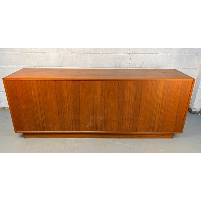 Beautiful mid-century modern Danish server crafted from richly grained teak. Features clean, minimalist lines and...