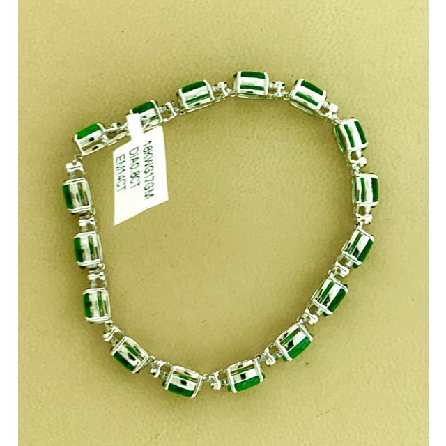 This exceptionally affordable Tennis bracelet has 16 stones of oval Emeralds . Each Emerald is spaced by a single diamonds...