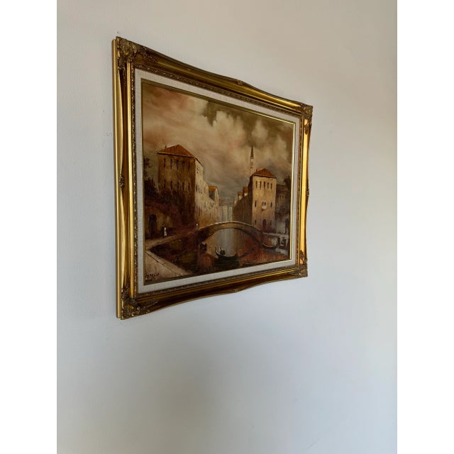 A Parisian canal scene, painted in oil on canvas, signed by the artist I Costello, dates to the 1980's. Costello's work...