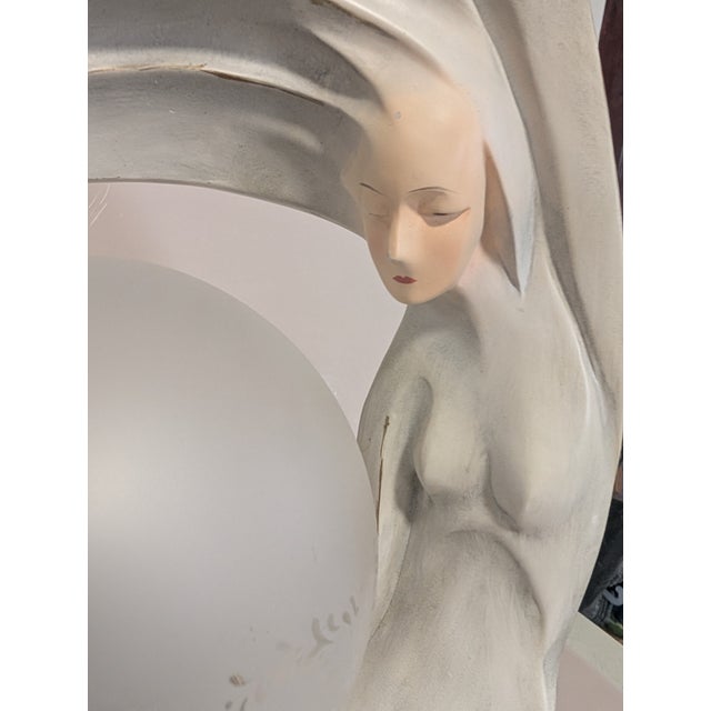 Art Deco Nude Sculpture Lamp Beautiful detail face The body sways around into a Moon like Aura Ceramic Felt on.bottom...