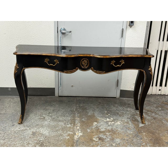 Design Plus Gallery presents the Regent Console Table by Lillian August for Drexel Heritage. The console has a black...