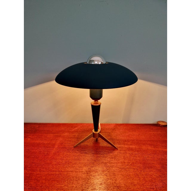 Philips tripod lamp, Bijou model, designed by Louis Kalff, 1950s-60s. This lamp, made of blue-green lacquered aluminum...