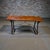 Late 19th to early 20th Century Spanish Baroque Style Table with Iron Stretchers. Warm colored top with darker spindle...