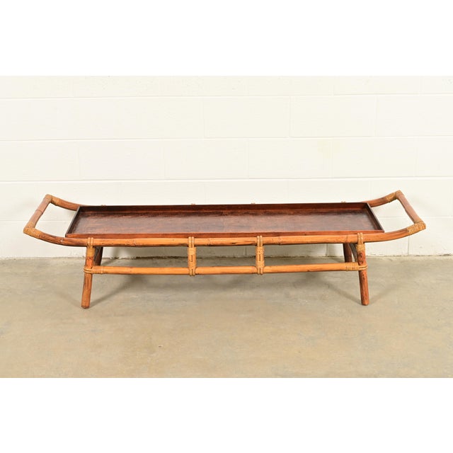 A gorgeous mid-century Hollywood Regency Organic Modern Pagoda form coffee table or cocktail table By John Wisner for...
