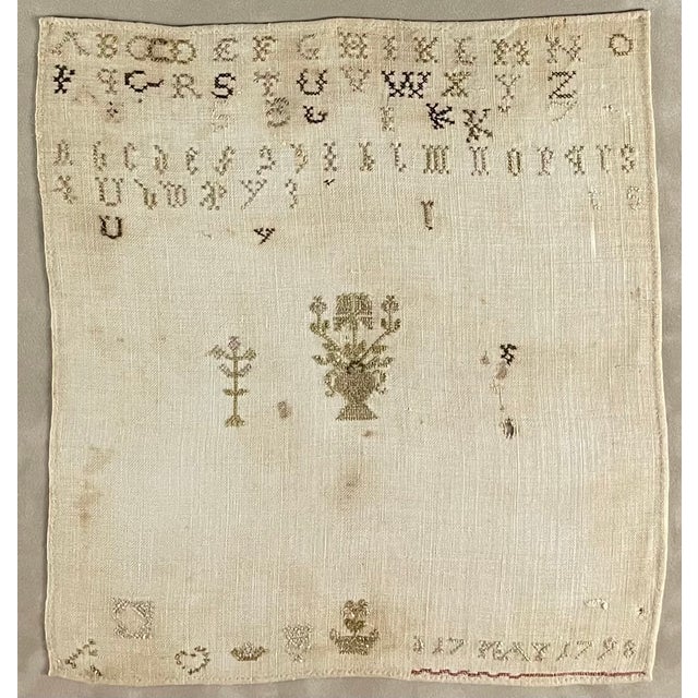 Linen alphabet sampler, dated 1798. Appears to be from Ireland, due to use of the heart and crown symbol (precursor to...