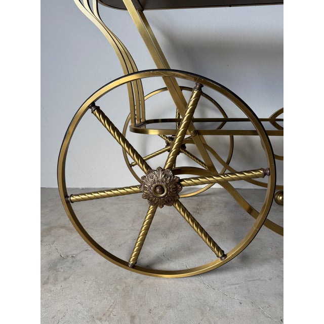 Metal 1960s Italian Hollywood Regency Scrolled Brass & Black Glass Two-Tier Bar Cart For Sale - Image 7 of 14