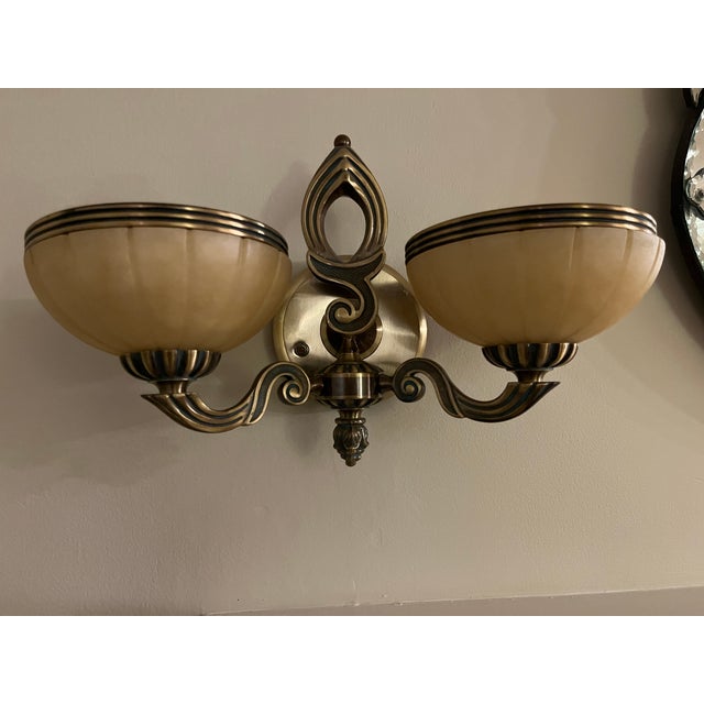 Alabaster 2 light wall sconces.. Antique brass. Adds elegance nice touch to any room. Can be sold as pair or individually.
