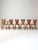 Set of six vintage 1940s oak dining chairs, comprising five side chairs and one armchair. Each chair features a sculpted...