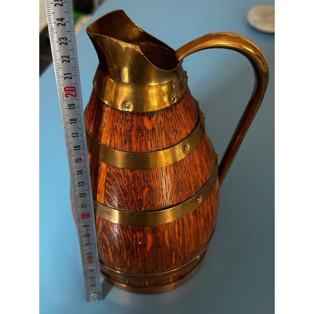 An elegant solid oak pitcher with a brass band, crafted by Gérard Lafitte and bearing the "Meilleur Ouvrier de France...