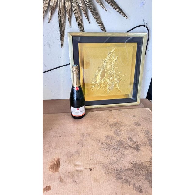 Modern Embossed Gold Shell Artwork, Luxurious Metallic Finish & Layered Framing : This stunning modern artwork, created...