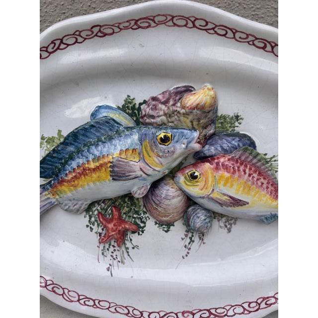 Mid-Century Majolica Palissy fishs platter Vallauris. in a white background faience in the style of Brard. 2 fishs...