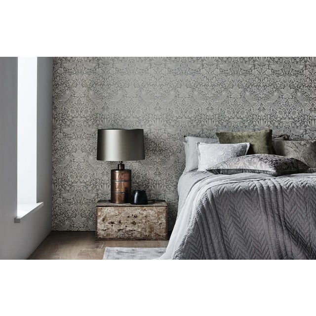 A cheeky bird pecks at delicious strawberries on this enticing flock-effect wallpaper. Reproduced with subtle textures to...