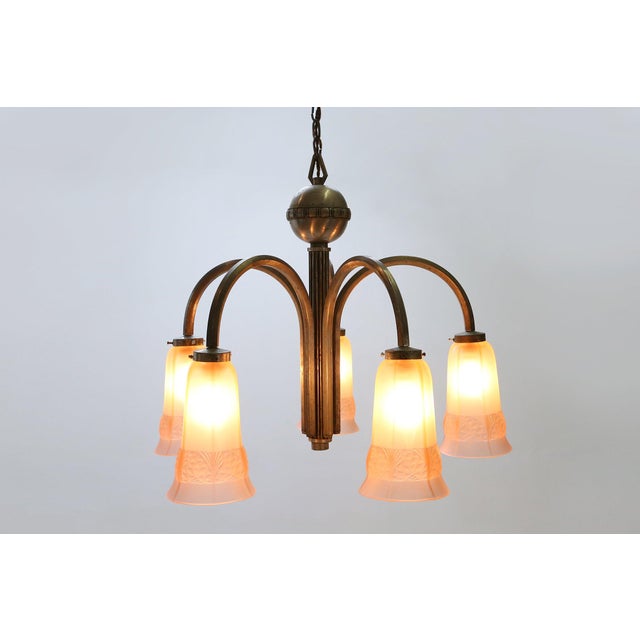 An elegant Belgian Art Deco chandelier from the early 1930s, defined by its sculptural copper arms, nickel accents and...