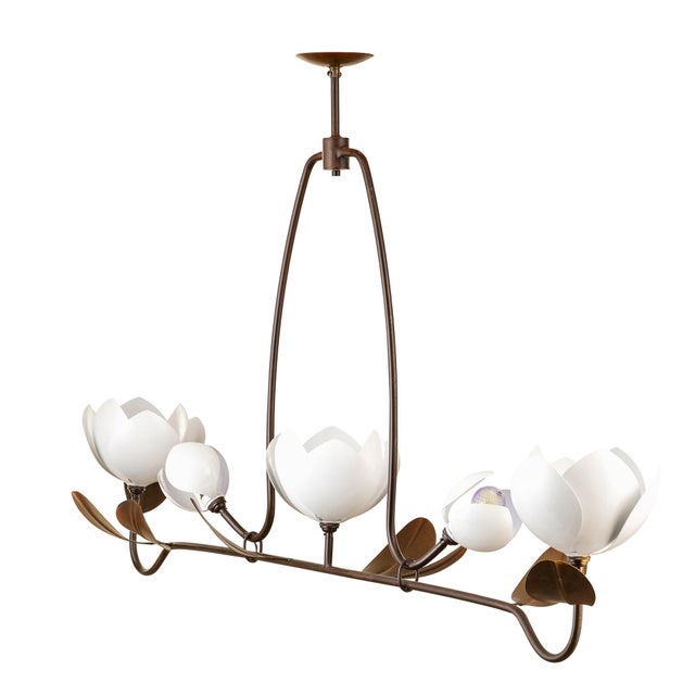 A 72-by-42-inch wall sculpture of intersecting steel bars in warm tones  magnolia petals abstracted to their outlines....