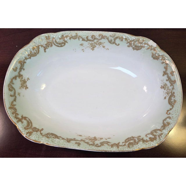 Antique Elite Works Limoges 10" Oval Serving Bowl - Gilded Scrolls & Celadon Dot Border Elevate your tablescape with this...