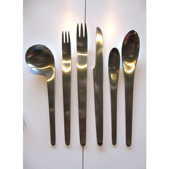 A 75 piece stainless steel flatware set having 12 six piece place settings with and extra special order 2 left handed soup...