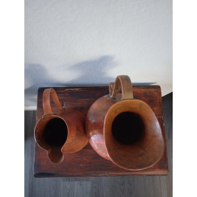 These copper pitchers are vintage hand-hammered original from Mexico. These beautiful pieces are preowned used as...