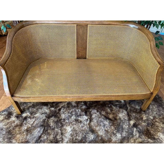Sophisticated tulipwood sofa with comfy velvet cushion seat. Canework seat and back. Have a lovely nap! Minton-Spidell...