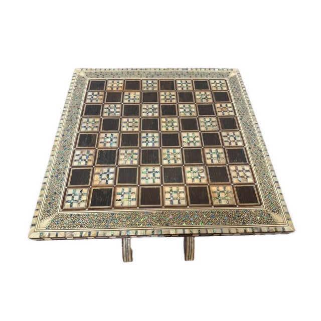 Handmade Arabic chess side table crafted from solid wood and richly inlaid with natural mother of pearl. The table...