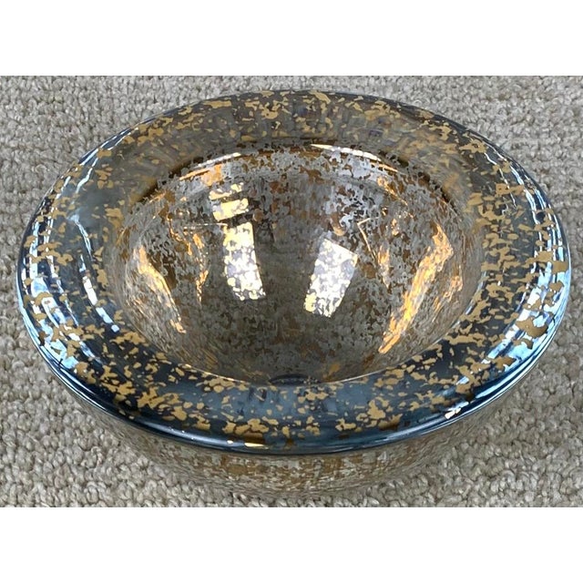 Vintage thick glass candy dish with gold metallic speckled design motif.