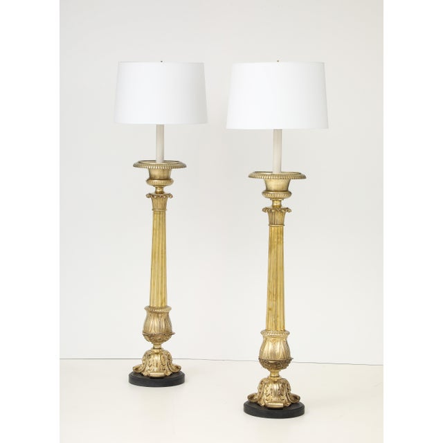 Large pair of 1940's French bronze with black stone base floor lamps, newly rewired and lightly hand polished, with some...