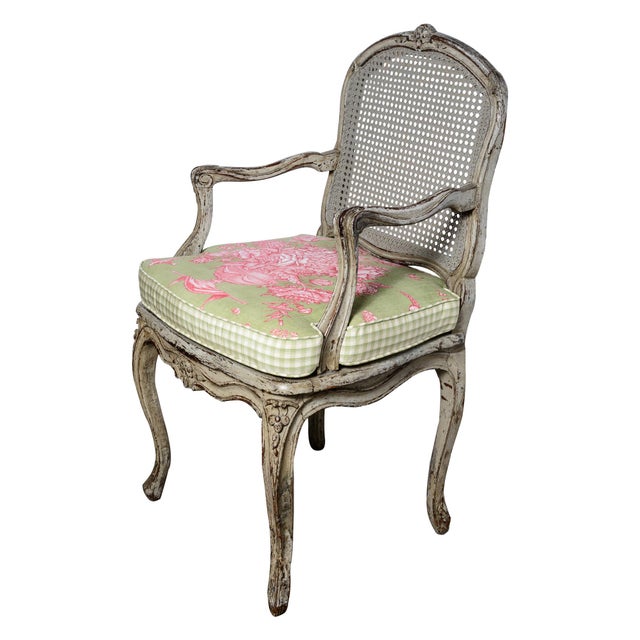 Just in, This pair features a 19th-century French Louis XV style painted armchair (or fauteuil/bergère) detailed with a...