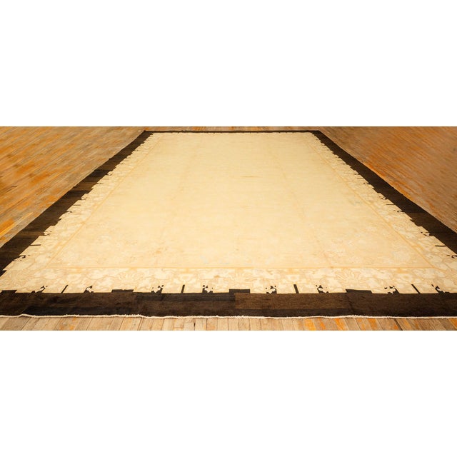 A magnificent palace-sized Antique Chinese Peking carpet, circa 1920. Measuring a commanding 12' x 17' 4", this piece...