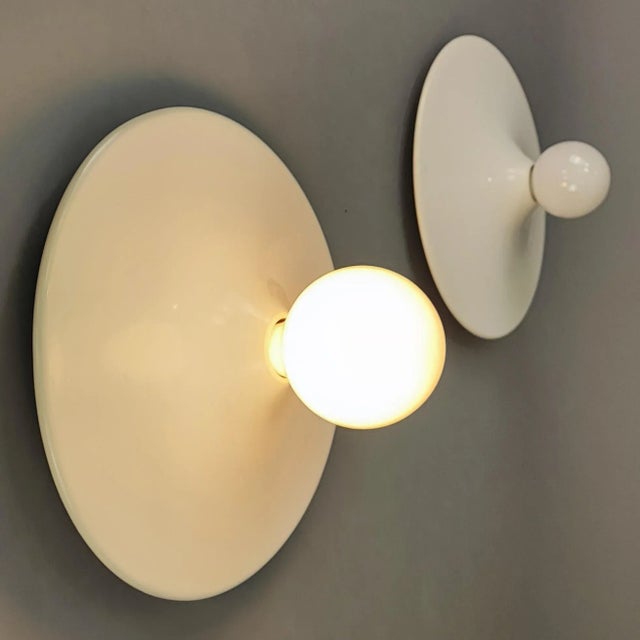 Pair of lamps by Gianluigi Gorgoni for Stilnovo, vintage 70s. Structure in white enamelled aluminium. Design period:...