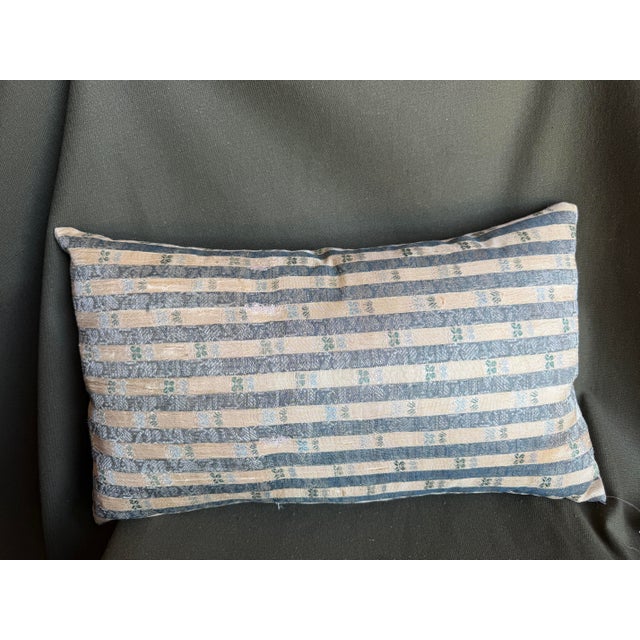 An exceptional 17th Century Persian Isfahan Metallic Pillow handcrafted from an authentic antique silk textile featuring...