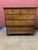 A handsome Georgian-style chest of drawers, distinguished by its timeless proportions and understated elegance. The piece...